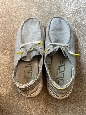 Hey Dude women’s Gray Slip-On Sneakers with Yellow Details